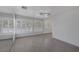 Spacious living room with wood-look floors and plantation shutters at 1720 Eastwood Dr, Las Vegas, NV 89104