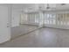 Well-lit living area boasts wood-look flooring and large windows at 1720 Eastwood Dr, Las Vegas, NV 89104