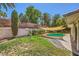Backyard featuring a swimming pool, covered patio, well-manicured lawn, and landscaped surroundings at 1905 Dakota Hills Ave, Las Vegas, NV 89123