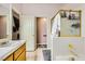 This bathroom provides a functional layout, featuring a tiled floor, shower, tub, and vanity at 1905 Dakota Hills Ave, Las Vegas, NV 89123