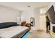 Spacious bedroom with walk in closet, tv, and ensuite bathroom at 1905 Dakota Hills Ave, Las Vegas, NV 89123