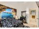 Bright bedroom with picturesque wall art, stylish black furniture, and a ceiling fan at 1905 Dakota Hills Ave, Las Vegas, NV 89123