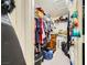 Walk-in closet with shelving and hanging space provides ample storage for clothing and accessories at 1905 Dakota Hills Ave, Las Vegas, NV 89123
