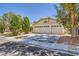 Attractive single-story house with a three-car garage, desert landscaping, and a paved driveway at 1905 Dakota Hills Ave, Las Vegas, NV 89123