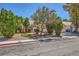 Single-story home with a neatly landscaped front yard and a convenient three-car garage at 1905 Dakota Hills Ave, Las Vegas, NV 89123