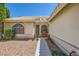 Charming home entrance with a tiled walkway, decorative statues, and a cozy seating area at 1905 Dakota Hills Ave, Las Vegas, NV 89123