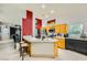Bright kitchen features an island, tile floors, and wooden cabinets at 1905 Dakota Hills Ave, Las Vegas, NV 89123
