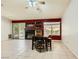Bright living room with tiled floors, sliding glass doors to the backyard, and a fireplace at 1905 Dakota Hills Ave, Las Vegas, NV 89123
