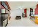 Open concept living space with tile flooring, fireplace, and access to the kitchen at 1905 Dakota Hills Ave, Las Vegas, NV 89123
