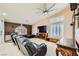 Open living space features a large ceiling fan, neutral walls, plush seating, and entertainment center at 1905 Dakota Hills Ave, Las Vegas, NV 89123