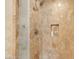Elegant bathroom featuring marble tile, glass shower door, and built-in shelving niche at 2000 N Fashion Show Dr # 5326, Las Vegas, NV 89109