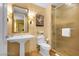 Elegant bathroom features a pedestal sink, toilet, and walk-in shower at 2000 N Fashion Show Dr # 5326, Las Vegas, NV 89109