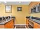 Bright and airy kitchen with updated stainless steel appliances and sleek black granite countertops at 2000 N Fashion Show Dr # 5326, Las Vegas, NV 89109