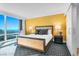 Cozy main bedroom featuring a comfortable bed, floor-to-ceiling windows and city views at 2000 N Fashion Show Dr # 5326, Las Vegas, NV 89109