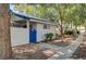 Exterior shot of a quaint home with a blue accent door and a neat, landscaped yard at 2028 Bavington Dr # A, Las Vegas, NV 89108