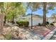 Charming single-story home with well-maintained landscaping and mature trees, showcasing a peaceful residential setting at 2028 Bavington Dr # A, Las Vegas, NV 89108