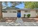 A welcoming home exterior with a blue gate and well-maintained landscaping, inviting entrance at 2028 Bavington Dr # A, Las Vegas, NV 89108