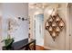 Decorated hallway featuring elegant lighting fixtures and an archway leading to other rooms at 2028 Bavington Dr # A, Las Vegas, NV 89108
