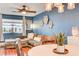 Living and dining area, featuring a comfortable sectional sofa, bright windows, and stylish decor, creates a welcoming atmosphere at 2028 Bavington Dr # A, Las Vegas, NV 89108