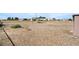 Large backyard featuring a wooden play structure and ample space for outdoor activities at 2440 Homestead Rd, Pahrump, NV 89048