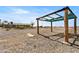 Backyard structure with wooden beams and a partially covered top, offering shade and character at 2440 Homestead Rd, Pahrump, NV 89048