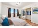 Cozy bedroom featuring a large window, closet, and soft carpeting at 2440 Homestead Rd, Pahrump, NV 89048