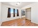 Bedroom featuring natural light, wood floors, and a closet with mirror doors at 2440 Homestead Rd, Pahrump, NV 89048
