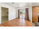 Dining area with wood floors, sliding glass doors, and natural light at 2440 Homestead Rd, Pahrump, NV 89048