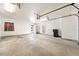 Spacious garage with high ceilings and a roll-up door, offering plenty of storage and parking space at 2440 Homestead Rd, Pahrump, NV 89048
