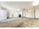Spacious garage with high ceilings, a roll-up door, and ample room for parking and storage at 2440 Homestead Rd, Pahrump, NV 89048