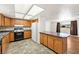 Cozy kitchen with oak cabinets, stone counter tops, and standard appliances at 2440 Homestead Rd, Pahrump, NV 89048