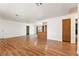 Open concept living room with wood floors and access to the kitchen at 2440 Homestead Rd, Pahrump, NV 89048