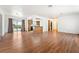 Spacious living room featuring hardwood floors and access to the kitchen and dining area at 2440 Homestead Rd, Pahrump, NV 89048