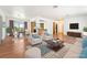 Open floor plan showcasing the living room's hardwood floors and bright, neutral decor at 2440 Homestead Rd, Pahrump, NV 89048