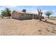 The home's rear exterior features a spacious yard and a covered patio, ideal for outdoor living at 2440 Homestead Rd, Pahrump, NV 89048