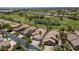 Aerial view of homes with mature palms, greenbelt, and golf course at 2505 Links Dr, Laughlin, NV 89029