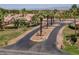 Aerial view of the community entrance with mature palm trees and desert landscaping at 2505 Links Dr, Laughlin, NV 89029