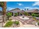 An inviting backyard with a serene rock garden and a covered patio, ideal for outdoor living at 2505 Links Dr, Laughlin, NV 89029