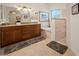 Luxurious bathroom featuring double sinks, bathtub, and tiled walk-in shower at 2505 Links Dr, Laughlin, NV 89029