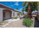 A charming entrance walkway with desert landscaping leads to a welcoming front door at 2505 Links Dr, Laughlin, NV 89029