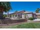 A Southwestern-style home with desert landscaping and a walled courtyard, showcasing outdoor charm at 2505 Links Dr, Laughlin, NV 89029