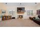 Living room featuring a fireplace, neutral paint, and views to the outside at 2505 Links Dr, Laughlin, NV 89029