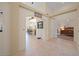 Entrance of the home showing the open floor plan with neutral tile and architectural features at 2505 Links Dr, Laughlin, NV 89029