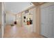 View of a spacious foyer with neutral tile flooring and access to the living areas and bedrooms at 2505 Links Dr, Laughlin, NV 89029