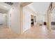 Hallway features tile floors, white walls, and doorways to bedrooms and other rooms at 2505 Links Dr, Laughlin, NV 89029