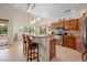 Kitchen with countertops and adjacent breakfast bar with seating at 2505 Links Dr, Laughlin, NV 89029