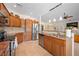 Spacious kitchen featuring stainless steel appliances, granite countertops, and wood cabinets at 2505 Links Dr, Laughlin, NV 89029