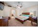 Spacious Primary bedroom features a ceiling fan and ensuite bathroom at 2505 Links Dr, Laughlin, NV 89029