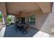 Covered patio perfect for outdoor dining with a ceiling fan to keep cool at 2505 Links Dr, Laughlin, NV 89029