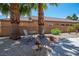 Cozy patio area with seating and charming landscaping, perfect for relaxing and entertaining at 2505 Links Dr, Laughlin, NV 89029